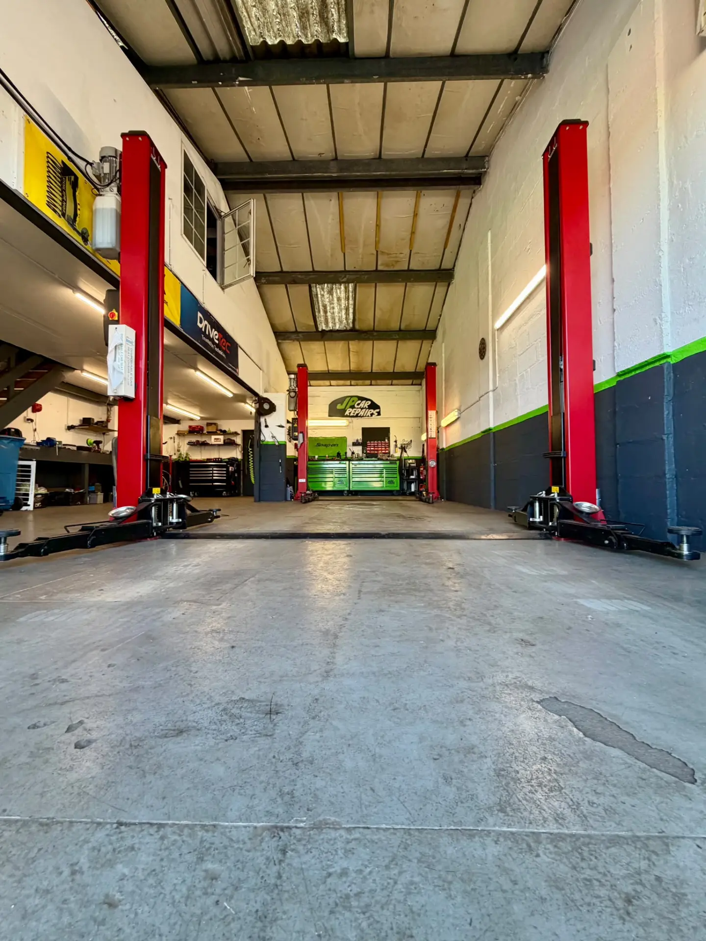 Vehicle ramps inside the JP Car Repairs workshop